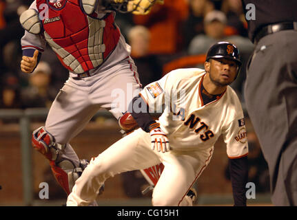 Pedro Feliz of the San Francisco Giants awaits a safe call from home plate umpire Bruce Froemming after scoring the tying run, 4-4 on a Bengie Molina 9th inning RBI Monday July 23, 2007 against Atlanta Braves  at AT&T Park in San Francisco, Calif. (Karl Mondon/Contra Costa Times) Stock Photo