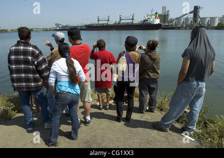 Whale watches gather on the levee across from the Port of Sacramento to watch two wayward humpback whales. Hundreds of people have come out to see the whales who experts are now trying to lure back down the river to sea. The Sacramento Bee/  Anne Chadwick Williams/  May 17, 2007 Stock Photo