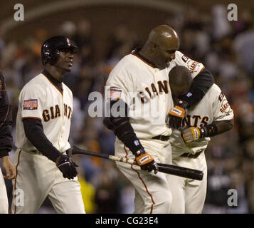 Giants Barry Bonds embraces Ray Durham following Durham's game winning hit in the bottom of the 9th inning in Saturday evenings game between the San Francisco Giants and Florida Marlins at AT&T Park in San Francisco, California  Photography by Jose Luis Villegas, July 28, 2007 Stock Photo