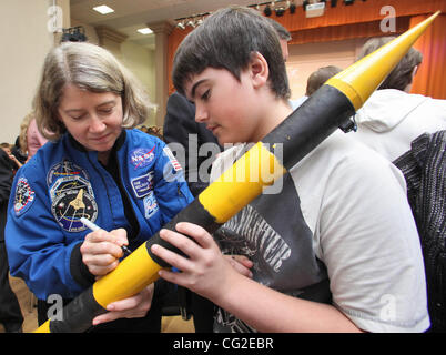 September 07,2011.St.Petersburg,Russia. Pictured: American astronaut Pamela Ann Melroy signs for a boy when meeting russian school children while visiting secondary school #531 of St.Petersburg. Astronaut Pamela Ann Melroy is a delegate of ASE XXIV Planetary Congress held in Russia. Stock Photo