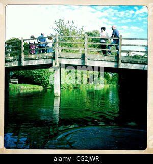 Sept. 26, 2011 - Dedham Vale, England, United Kingdom - People walking on a bridge in Constable Country. John Constable (11 June 1776 - 31 March 1837) was an English Romantic painter. Born in Suffolk, he is known principally for his landscape paintings of Dedham Vale, the area surrounding his home,  Stock Photo