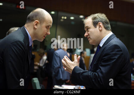 Sept. 29, 2011 - Brussels, BXL, Belgium -  Edward Davey, British Minister for Employment Relations, Consumer, and Postal Affairs, chats with the Chairman of competitivness council, Polish state secretary Marcin Korolec (L)  at the start of a European Competitiveness Council at the EU headquaters   i Stock Photo