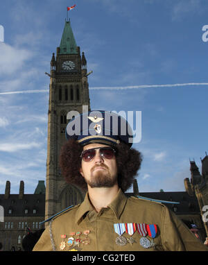 Executed Libyan Leader, Colonel Moammar Gadhafi were also seen during the Ottawa Zombie Walk. Hundreds of zombies take over downtown Ottawa for the annual Zombie Walk 2011 on 22 October 2011. Participants, largely made up of teenagers dress up and make over their faces to look like flesh-eating zomb Stock Photo