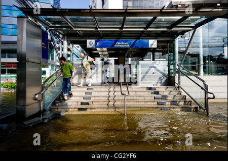 Nov. 10, 2011 - Bangkok, Thailand - Residents exit MRT underground train station in flooded of Bangkok, Thailand. Floodwaters are creeping further into city's center. Thailand is suffering from worst flooding in 50 years. Over 400 people have died due to flooding since late July according to Departm Stock Photo