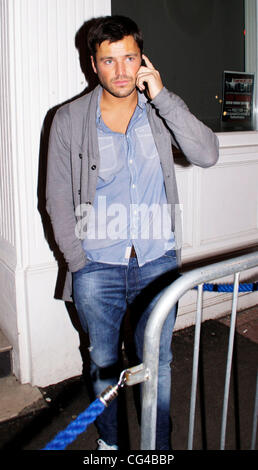 Mark Wright takes a call outside Funky Mojoe club In South Woodford Essex, England - 28.01.11 Stock Photo
