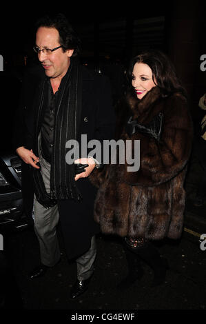 Joan Collins and Percy Gibson leave C London restaurant London, England - 01.02.11 Stock Photo