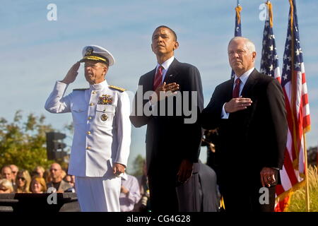 Chairman of the Joint Chiefs of Staff Adm. Mike Mullen, President Barack Obama and Defense Secretary Robert M. Gates render honors during the playing of the national anthem at the Pentagon Memorial, during a ceremony marking the ninth anniversary of the S