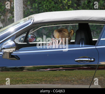 Melanie Griffith seen smoking and chatting on the phone while out driving in Beverly Hills. Los Angeles, California - 24.09.10 Stock Photo