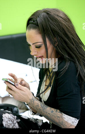 Jodie Marsh poses in a giant bed before attempting to complete a record-breaking 24-hour three-way call at Victoria station London, England - 30.09.10 Stock Photo