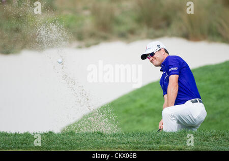 23rd Aug 2012. Bethpage, Famingdale, New York.    Zach Johnson (USA) hits a ball out of the 16th hole bunker during The Barclays Championship for The FedEx Cup played at Bethpage Black in Farmingdale, NewYork. Stock Photo