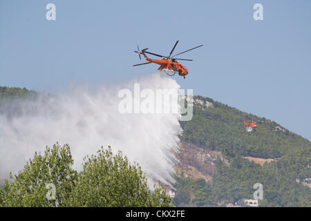 Erickson Air-Crane dropping water on wildfire. Stock Photo