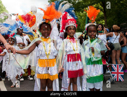 26th Aug 2012. London, UK. Children dancing along the route of Notting Hill Carnival. Stock Photo