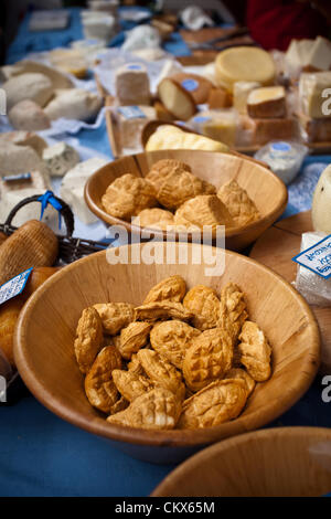 August 26, 2012 Cracow, Poland - Market stall during annual traditional Polish food festival. Shown Oscypek is a smoked cheese made of salted sheep milk exclusively in the Tatra Mountains region of Poland. Stock Photo