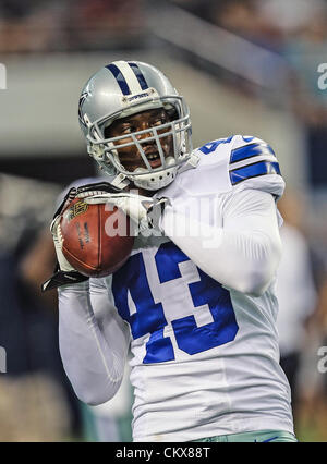 Dallas Cowboys linebacker Sean Lee (50) is congratulated by linebacker  DeMarcus Ware (94) and safety Gerald Sensabaugh (43) after getting a tackle  for a Chicago Bears loss at Cowboy's Stadium in Arlington