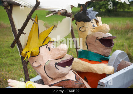 27 August 2012. Bisterne, New Forest National Park, Hampshire, UK. Bisterne Scarecrow Festival 2012. Yubba Dubba Doo. The Flintstones in their car. Credit:  Carolyn Jenkins / Alamy Live News Stock Photo