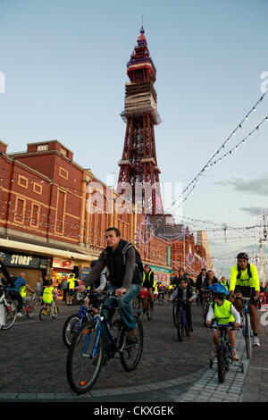 Blackpool, UK. 28th Aug 2012. Every year, cyclists of all ages and abilities with everything from kiddies tricycles to unicycles ride up and down the promenade in Blackpool Lancashire, to celebrate the switching on of the world famous Blackpool Illuminations. Credit:  Barrie Harwood / Alamy Live News Stock Photo