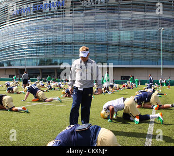 Aviva Stadium, Dublin, Ireland. 30th Aug 2012. Emerald Isle Classic. Head Coach Brian Kelly checks his players as they warm up. Notre Dame training session. Aviva Stadium. Credit:  Action Plus Sports Images / Alamy Live News Stock Photo