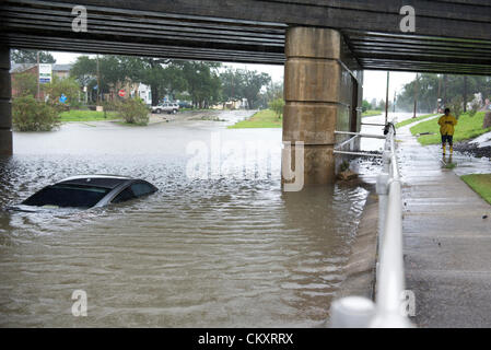 Lakeview, New Orleans. August 29th 2012. 2 cars remain submerged on Canal Boulevard in Lakeview, New Orleans on August 29 2012 after motorists attempt driving through low lying, flooded areas. Tropical Storm Isaac continues to hover over New Orleans while many drivers are unaware of the depths of flooded areas. Stock Photo