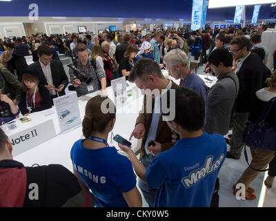 Crowds of visitors to Samsung hall to see new which was released today  31 August 2012 the opening day of the annual IFA (or Internationale Funkausstellung ) consumer electronics and electrical products show held in Berlin Messe Trade Show Halls Germany. Stock Photo