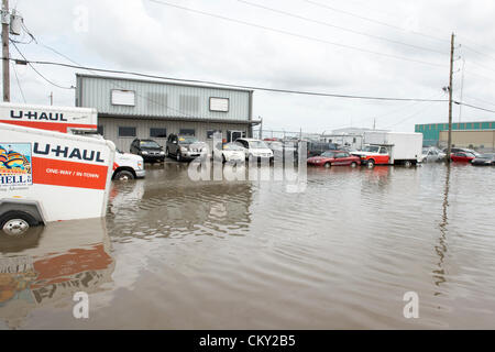 Floodwaters remain on Friday, August 31 2012 in New Orleans suburbs following Hurricane Isaac's hovering rainfall. Daily high tides have created a continuing surge of floodwaters into unexpected areas. Many blame the Corps of Engineers for diverting floodwater overflow into the suburbs during the restructuring of New Orleans flood control system following Hurricane Katrina. Stock Photo