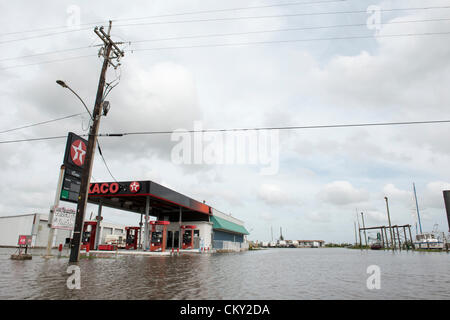 Floodwaters remain on Friday, August 31 2012 in New Orleans suburbs following Hurricane Isaac's hovering rainfall. Daily high tides have created a continuing surge of floodwaters into unexpected areas. Many blame the Corps of Engineers for diverting floodwater overflow into the suburbs during the restructuring of New Orleans flood control system following Hurricane Katrina. Stock Photo