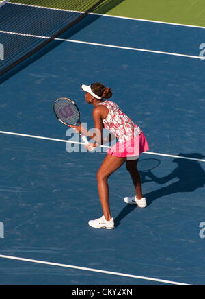 Venus Williams of the USA during the women's doubles second round match on Day Five of the 2012 US Open on August 31, 2012. She and her sister, Serena WIlliams, are playing against Kristina Mladenovic, France, and Klaudia Jans-Ignacik, Poland at the Billie Jean King National Tennis Center in Flushing, New York. Stock Photo