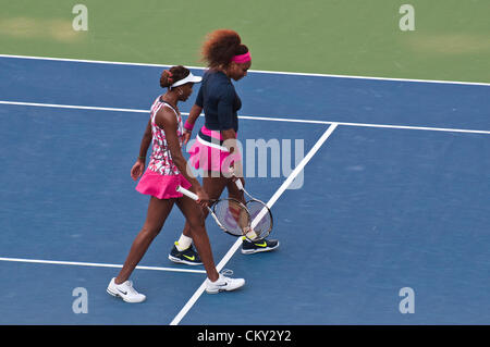 Serena Williams and Venus Williams of the USA during the women's doubles second round match against Kristina Mladenovic, France, and Klaudia Jans-Ignacik, Poland, on Day Five of the 2012 US Open on August 31, 2012 at the Billie Jean King National Tennis Center in Flushing, New York. Stock Photo