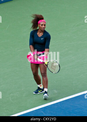 Serena Williams of the USA serving during the women's doubles second round match on Day Five of the 2012 US Open on August 31, 2012. She and her sister, Venus WIlliams, are playing against Kristina Mladenovic of France, and Klaudia Jans-Ignacik of Poland at the Billie Jean King National Tennis Center in Flushing, New York. Stock Photo