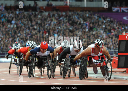 London, UK. 31st Aug 2012 - Tomasz Hamerlak (POL) leading a tightly packed group of wheelchair racers during a heat for the 5000m T54 race in the Olympic stadium at the 2012 London Summer Paralympics. Front of pack is, (left to right): David Weir (GBR), Sukman Hong (KOR), Tomasz Hamerlak (POL). (C) Michael Preston / Alamy Live News. Stock Photo