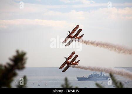 Bournemouth, UK Friday 31 August 2012. Breitling wingwalkers wing walkers performing at the Bournemouth Air Festival, Bournemouth, UK. The Breitling wingwalkers  have since become the AeroSuperBatics Wingwalkers. Credit:  Carolyn Jenkins / Alamy Live News Stock Photo