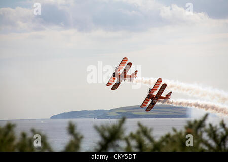 Bournemouth, UK Friday 31 August 2012. Breitling wingwalkers wing walkers performing at the Bournemouth Air Festival, Bournemouth, UK. The Breitling wingwalkers  have since become the AeroSuperBatics Wingwalkers. Credit:  Carolyn Jenkins / Alamy Live News Stock Photo