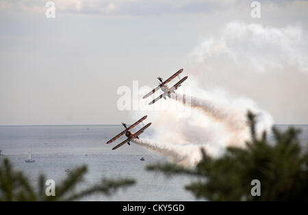 Bournemouth, UK Friday 31 August 2012. Breitling wingwalkers wing walkers performing at the Bournemouth Air Festival, Bournemouth, UK. The Breitling wingwalkers  have since become the AeroSuperBatics Wingwalkers. Credit:  Carolyn Jenkins / Alamy Live News Stock Photo