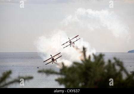 Bournemouth, UK Friday 31 August 2012. Breitling wingwalkers wing walkers performing at the Bournemouth Air Festival, Bournemouth, UK The Breitling wingwalkers  have since become the AeroSuperBatics Wingwalkers. Credit:  Carolyn Jenkins / Alamy Live News Stock Photo