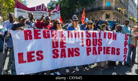 Paris, France, Collective African Immigrants Without Documents , réfugiés Carrying Protesters Banners Sans Papiers, in Public Demonstration, immigration law rally, protest, labor immigrants rights, protesters multiracial human rights, undocumented people, illegal migrants Stock Photo