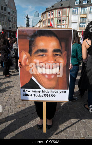 Saturday 1st September 2012. Anti-US poster featuring Barack Obama at Pro-Assad demonstration against civil war in Syria and against outside involvement by the US and UN in historic Römerberg square in central Frankfurt, Germany. Stock Photo