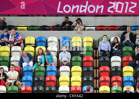 02.09.2012 London, England. womens goalball preliminaries match no. 30 (SWE) vs (JPN) score 0-0  spectators sit amongst empty seats during Day 4 of the London 2012 Paralympic Games at the Copper Box in Stratford Stock Photo