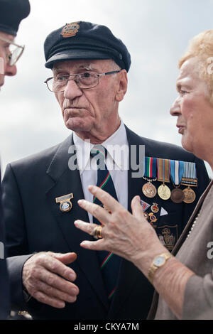 merchant navy veterans gather at the merchant navy memorial at liverpool pier head on merchant navy day Stock Photo