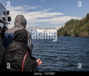 July 1, 2012 - Kenai Peninsula Borough, Alaska, US - Tour boat visitors view the majestic Holgate Glacier at the end of the Holgate arm of Aialik Bay off the Gulf of Alaska in Kenai Fjords National Park. Its source is the vast Harding Icefield in the Kenai Mountains. Established in 1980, the National Park covers 1,760 square miles of the Kenai Peninsula. (Credit Image: © Arnold Drapkin/ZUMAPRESS.com) Stock Photo