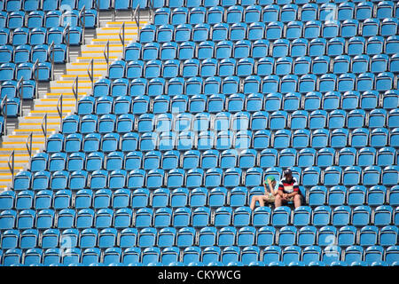 London, UK. 5th September 2012. Spectators sit amongst empty seats during the Men's Football 7-a-side Preliminaries Pool A match between Argentina and Netherlands during Day 7 of the London Paralympics from the Riverbank Arena. Credit:  Action Plus Sports Images / Alamy Live News Stock Photo