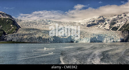 July 1, 2012 - Kenai Peninsula Borough, Alaska, US - Impressive, awe-inspiring, Aialik Glacier is at the North end of Aialik Bay off the Gulf of Alaska and is the largest tidewater glacier of Kenai Fjords National Park. Some 300 to 400 feet high from sea level, its source is the vast Harding Icefield in the Kenai Mountains. Established in 1980, the National Park covers 1,760 square miles of the Kenai Peninsula. (Credit Image: © Arnold Drapkin/ZUMAPRESS.com) Stock Photo