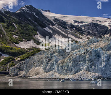 July 1, 2012 - Kenai Peninsula Borough, Alaska, US - The South end of impressive, awe-inspiring, Aialik Glacier, rising some 300 to 400 feet from sea level. At the North end of Aialik Bay off the Gulf of Alaska it is the largest tidewater glacier of Kenai Fjords National Park, its source in the vast Harding Icefield in the Kenai Mountains. Established in 1980, the National Park covers 1,760 square miles of the Kenai Peninsula. (Credit Image: © Arnold Drapkin/ZUMAPRESS.com) Stock Photo