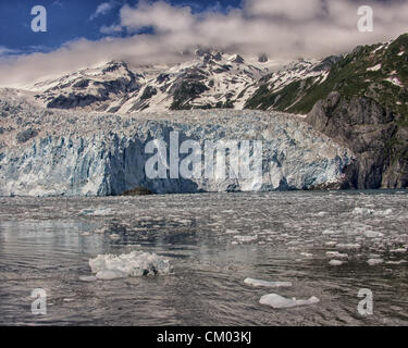 July 1, 2012 - Kenai Peninsula Borough, Alaska, US - The North end of impressive, awe-inspiring, Aialik Glacier, rising some 300 to 400 feet from sea level. At the North end of Aialik Bay off the Gulf of Alaska it is the largest tidewater glacier of Kenai Fjords National Park, its source in the vast Harding Icefield in the Kenai Mountains. Established in 1980, the National Park covers 1,760 square miles of the Kenai Peninsula. (Credit Image: © Arnold Drapkin/ZUMAPRESS.com) Stock Photo