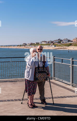 Southwold, Suffolk, UK. 7th September 2012. An elderly couple enjoy the sunny weather on Friday 7th of September 2012 at the Southwold Pier on the East Coast at Southwold, Suffolk, England, Britain, Uk. Credit:  Tim Oram / Alamy Live News Stock Photo