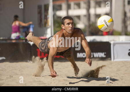 Sept. 7, 2012 - Santa Barbara, CA, USA - Santa Barbara, CA - September 7th, 2012 - Pedro Brazao playing with partner Paul Baxter, dives for a ball hit by opponents Matt Fuerbringer/Nick Lucena in the AVP Beach Championships beach volleyball tournament held in West Beach, Santa Barbara, CA. It is the second tournament put on by the newly reformed AVP, after they had to shut their doors more than 2 years ago. Fuerbringer/Lucena won the match 21-16, 19-21, 15-12. Photo by Wally Nell/Zuma (Credit Image: © Wally Nell/ZUMAPRESS.com) Stock Photo