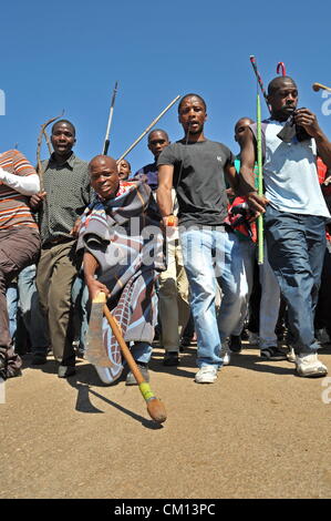 RUSTENBURG, SOUTH AFRICA: Lonmin mine workers march to three different mines demanding that shafts be closed down and workers join them in their wage strike on September 10, 2012 in Rustenburg, South Africa. The workers have been protesting for over three weeks. (Photo by Gallo Images / Dino Lloyd) Stock Photo