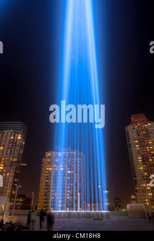 One of the beams of light of the Tribute in Light, an annual remembrance of the events of September 11, 2001, shines into the night sky in New York City. Stock Photo