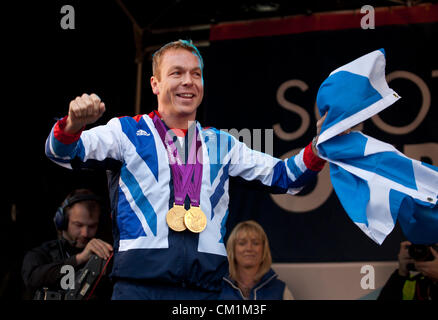 14th September, 2012. Sir Chris Hoy, the UK's most successeful Olympian, holding a Saltire and wearing his two 2012 Cycling  Gold Medals, at the end of the homecoming parade to honour Scotland's Olympians and Paralympians from London 2012, in George Square, Glasgow, Stock Photo