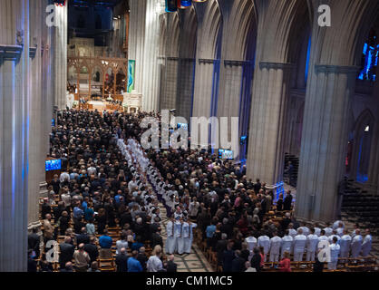 Acolytes lead the recessional through the Nave at the conclusion of a memorial service celebrating the life of Neil Armstrong September 13, 2012 at the National Cathedral in Washington, DC. Armstrong, the first man to walk on the moon during the 1969 Apollo 11 mission, died August 25. He was 82. Stock Photo
