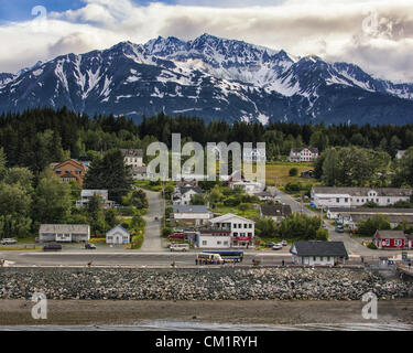 July 4, 2012 - Haines, Alaska, US - Haines, a popular cruise ship destination, is located between the Chilkoot and Chilkat Rivers on the western shore of the Lynn Canal, the longest fjord in America. The majestic Chilkat Mountain Range provides a spectacular backdrop. In its center is the parade grounds of the old Fort Seward. (Credit Image: © Arnold Drapkin/ZUMAPRESS.com) Stock Photo