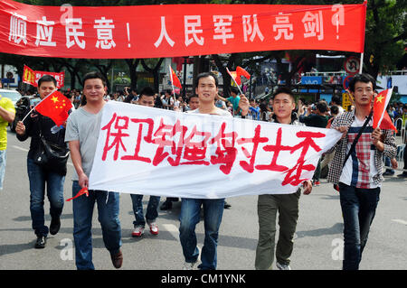 Xian,China. Saturday 15th September, 2012. Anti-Japanese protesters have a demonstration at the gate of Bell Tower Hotel in Xi'an,China,on Saturday Sept 15, 2012. Fights broke out between demonstrators and police during a march by more than 10,000 students, who were protesting at the sovereignty of the Fishing Islands(Diaoyu Islands). Stock Photo